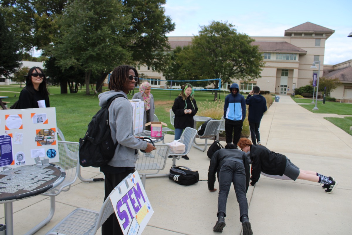 Students doing push ups for a trivia challenge